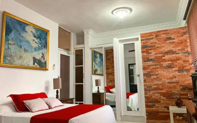 Malecon Rooms y Hotel