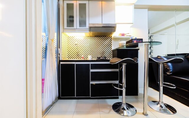Monochrome Style 2 Bedrooms at Kalibata City Apartment By Travelio