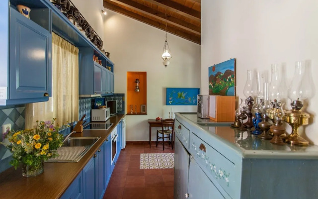 Dine on the Generous Veranda at a Rustic Stone Getaway