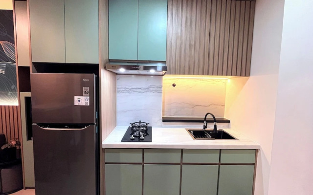 Warm And Homey 2Br At Vida View Makassar Apartment