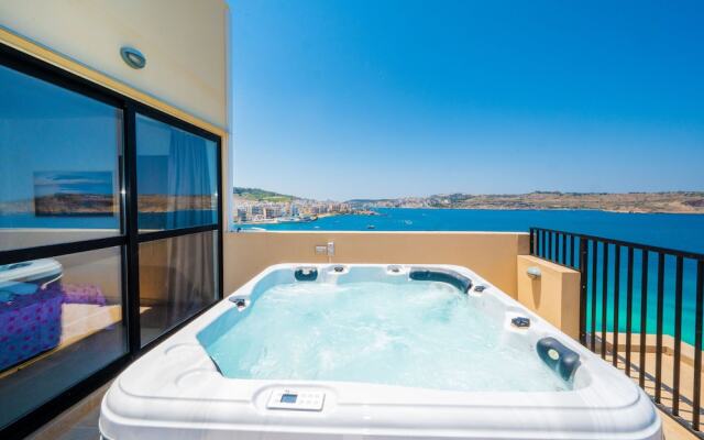 Islet Seafront Penthouse with Hot tub
