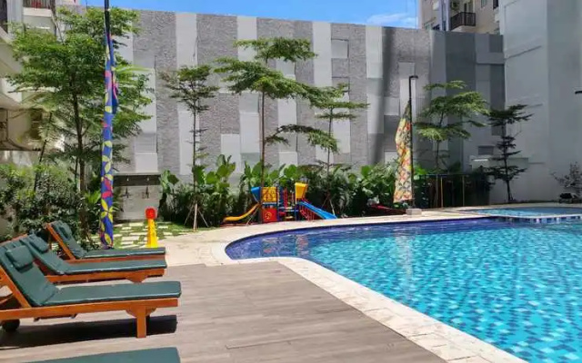 Homey 2BR Apartment at Signature Park Grande By Travelio