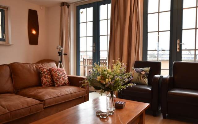 Exclusive Holiday Home Floating on a Lake in Friesland