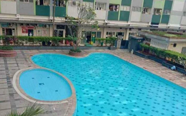 THE ROOMOS Hotel Apartemen