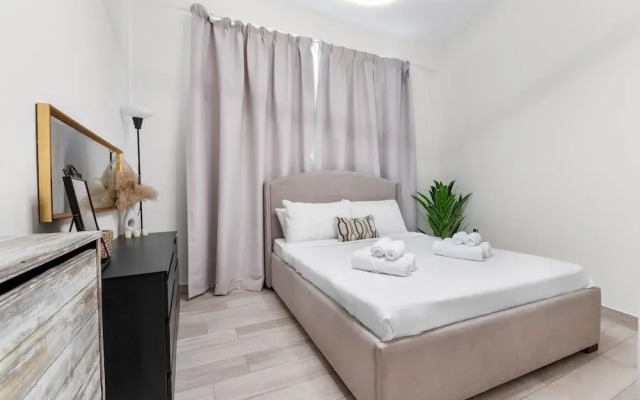 Waves - Stylish 1BR in JVC with Balcony & Pool