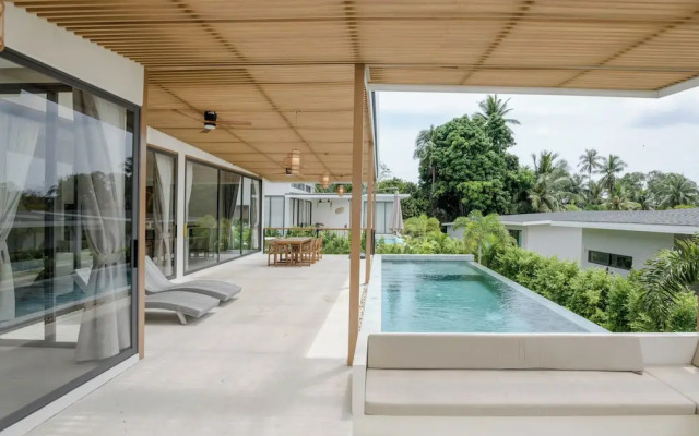 Tropical Poolside Retreat by Sea N' Rent