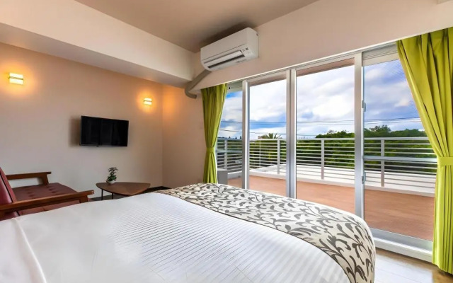 Mr.KINJO in front of Manza Beach