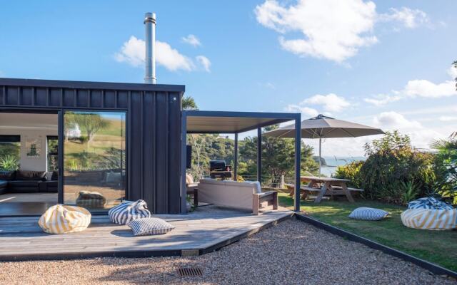 Wharetana Bay Villa with beach walkway