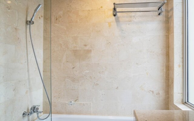 Cozy 2BR at Empyreal Epicentrum Apartment By Travelio