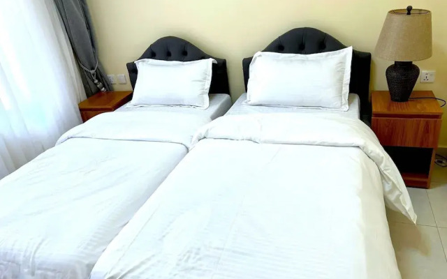 Q-Plus Apartments