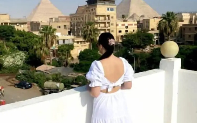 Nefertiti Pyramids View