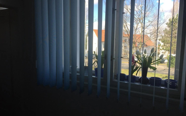 Blue apartment in beautiful English style garden with atmosphere