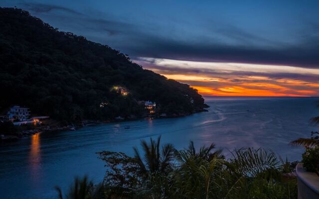 Luna Suite with two king size beds, with walk out terrace overlooking the beach