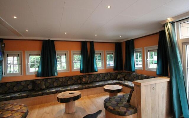 Designed home with bedstead, surrounded by forest
