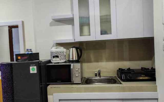 Comfy and Homey 2BR at Vida View Apartment By Travelio