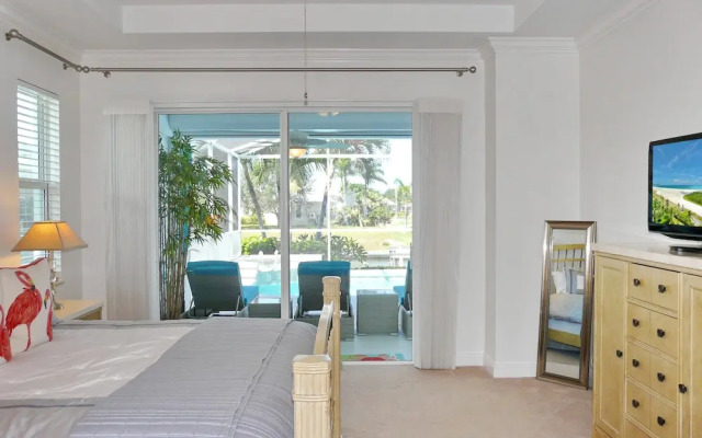 Relaxing Waterfront Home With Pool and Steps to Beach