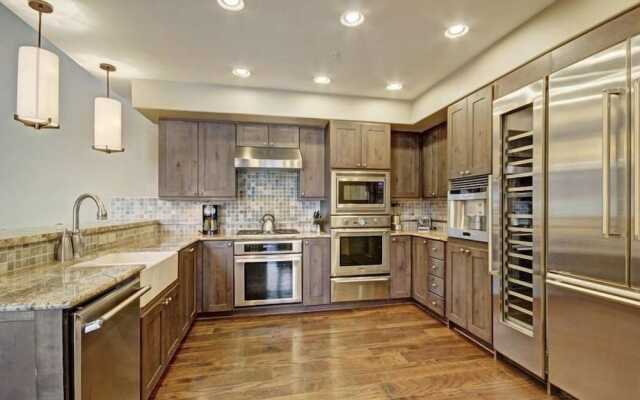 Expansive 4 Bedroom Ski in, Ski out One Ski Hill Residence Located at the Base of Peak 8 with Beautiful Views