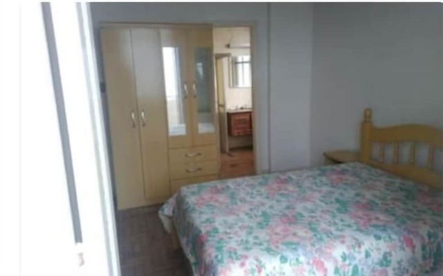 Apart de frente para a praia