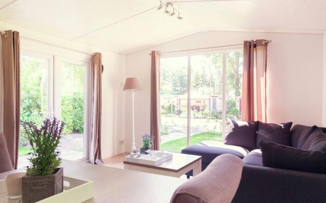 Comfortable chalet with a garden, at nature reserve