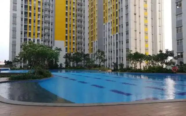 Modern White Studio At Springlake Summarecon Bekasi Apartment By Travelio