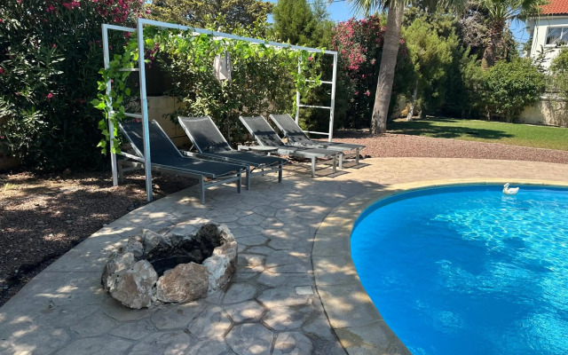 Mediterranean poolside garden cottage