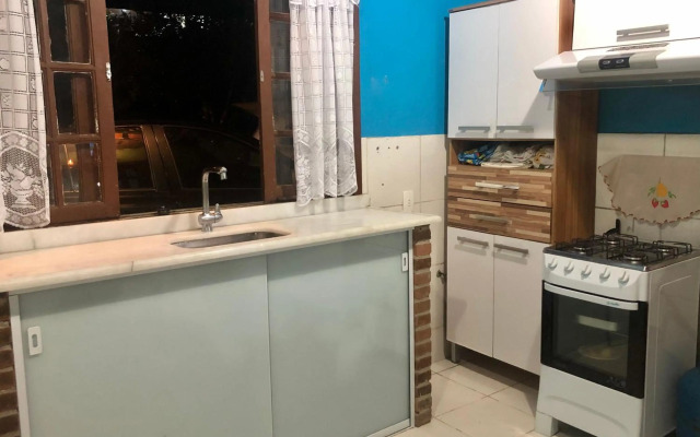 Casa da mata com piscina natural em condomínio