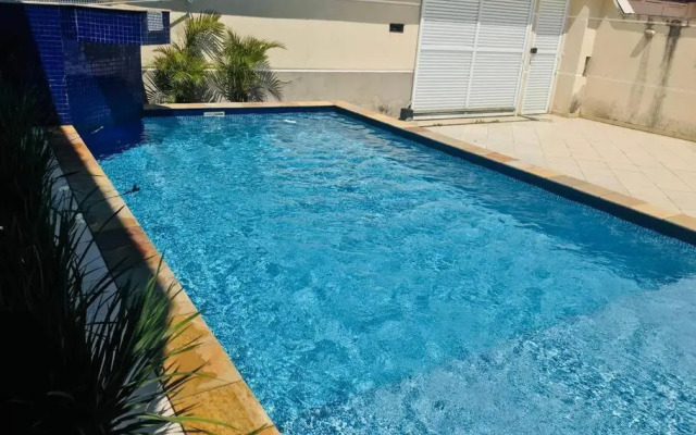 Casa de praia com piscina e churrasqueira - Indaiá Bertioga
