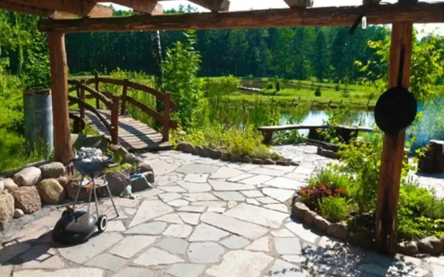 Rustic Riverside Cabin in Forest