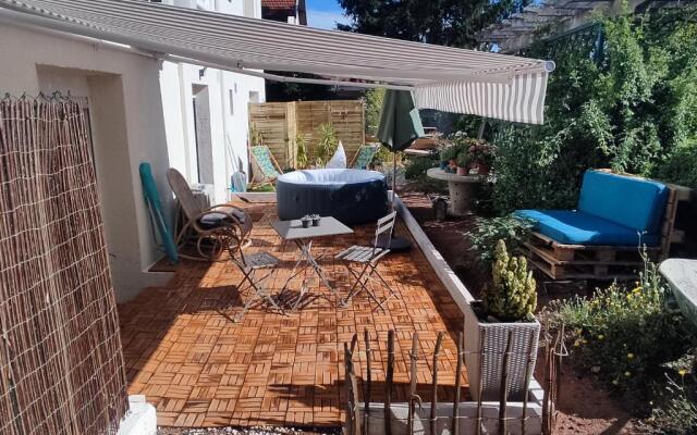 Superbe appartement avec jacuzzi avec jardin privé