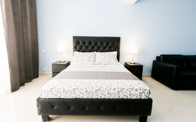 Ducassi Suites Rooftop Pool Beach Club & Spa