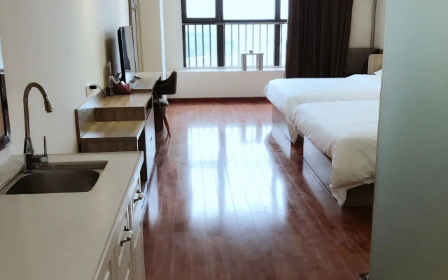 Xingyue Apartment Luogang Wanda