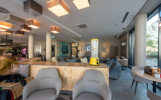 Отель Holiday Inn - the niu, Timber Esslingen, an IHG Hotel