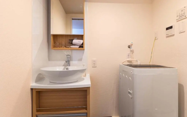 Mr.KINJO in front of Manza Beach