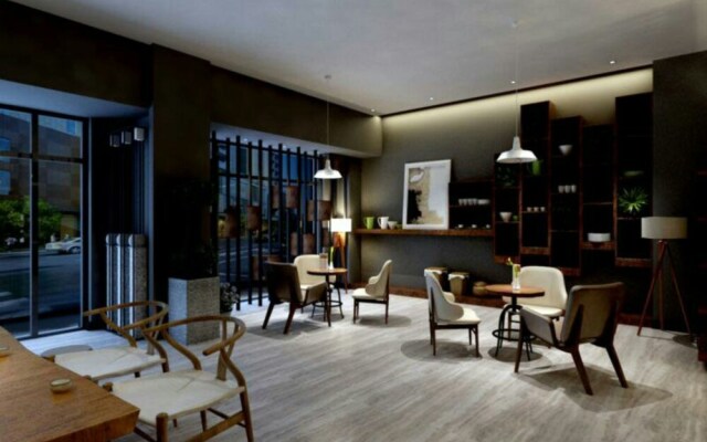 Yumi Apartment Xishuangbaina Branch