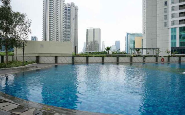 Best Location 2BR Apartment at The Wave Kuningan By Travelio