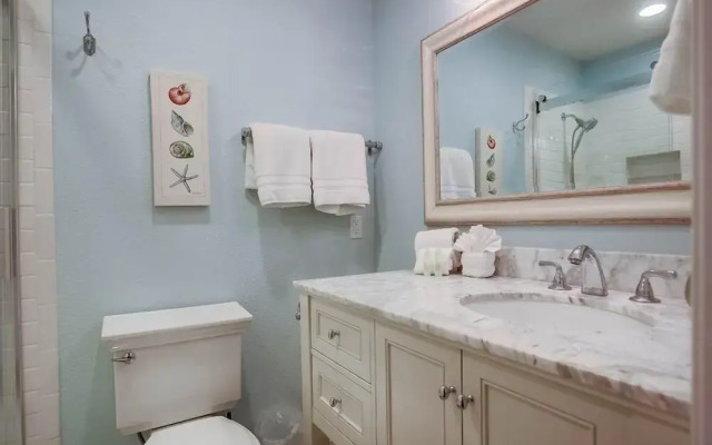 Coastal Chic Furnishings Condo Steps to Beach SBTC 128 by RedAwning