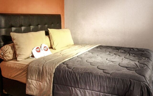 Ten House Guest & Resto by RedDoorz