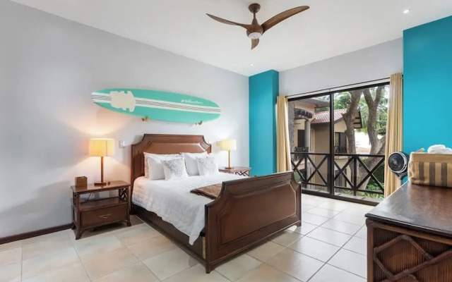 Modern Island-Themed Condo with Floor-to-Ceiling Windows & Garden and Pool Views Within Walking Distance of the Beach