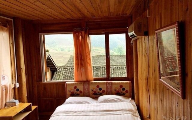 Longsheng Zhaihualou Inn