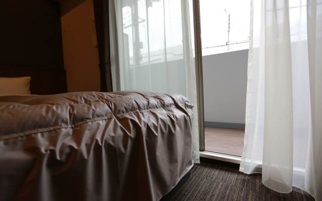 The Base Sakaihigashi Apartment Hotel
