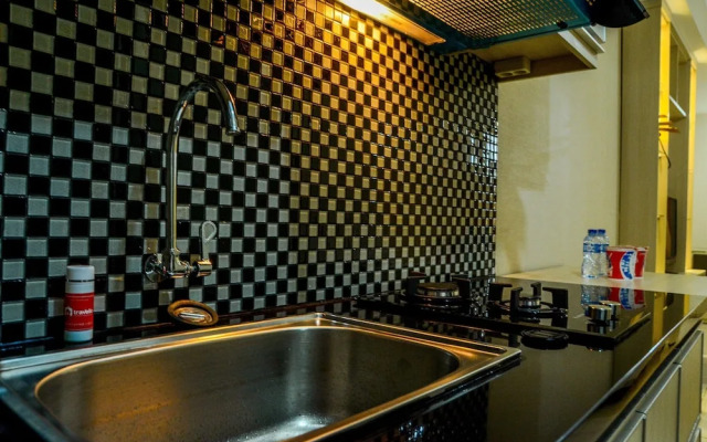 Modern Studio Grand Serpong Apartment By Travelio