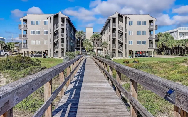 Newly Remodeled Oceanfront Condo with Salt Water Pool and Private Walkway to Beach by RedAwning
