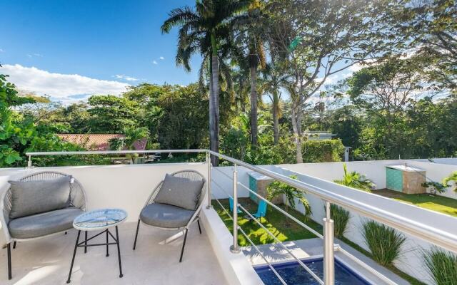 Ultramodern Townhome with an Inviting Coastal Design and Lush Outdoor Oasis with a Private Pool