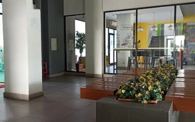 THE ROOMOS Hotel Apartemen