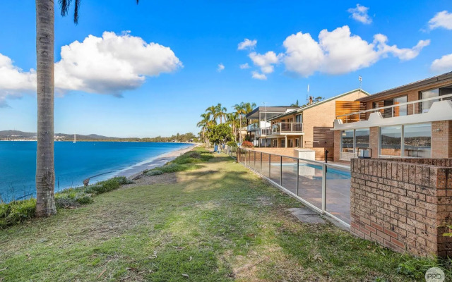 Seaside Sanctuary - Waterfront Luxury Home with Heated Pool