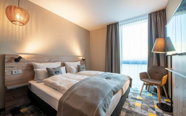 Отель Holiday Inn - the niu, Timber Esslingen, an IHG Hotel