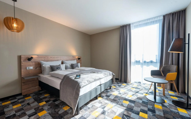 Отель Holiday Inn - the niu, Timber Esslingen, an IHG Hotel