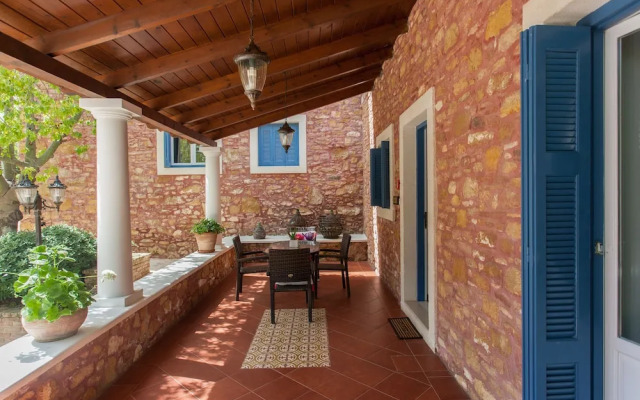 Dine on the Generous Veranda at a Rustic Stone Getaway