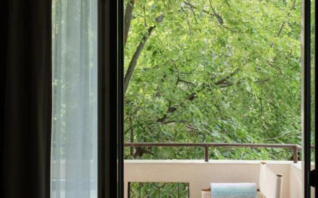 Design Central Studio Apartment with Balcony by Hostlovers
