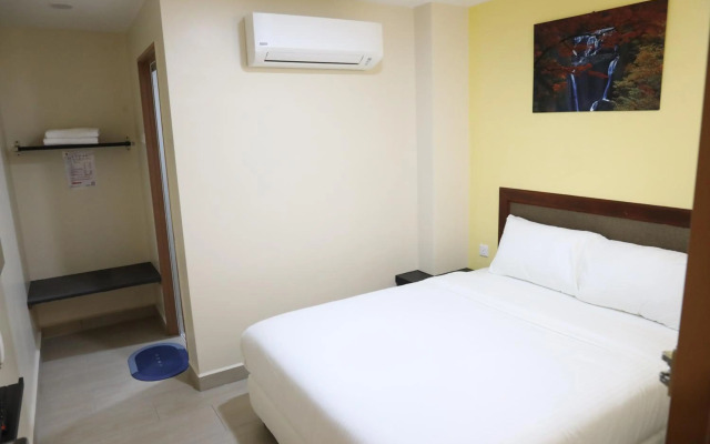 Capital O 90897 Island City Hotel